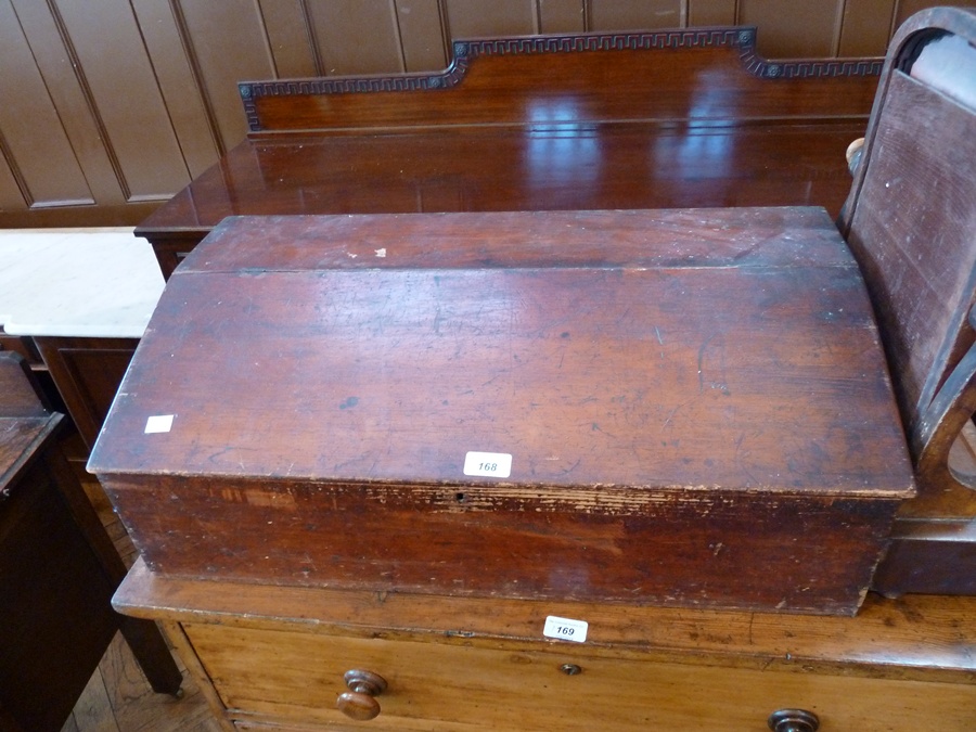 An old Victorian stained pine writing box with hinged sloping top together with a nineteenth century