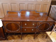 Edwardian mahogany sideboard, dentil carved border and decoration with foliate relief and brass