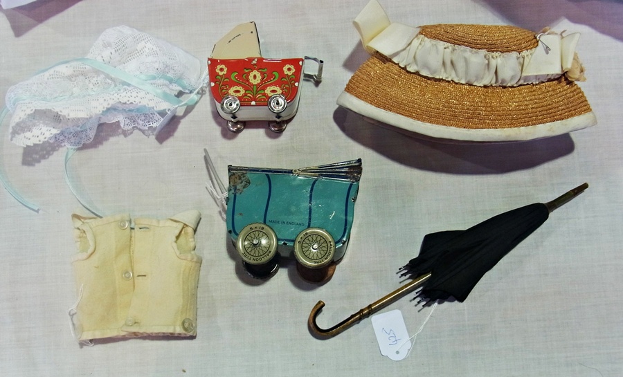 Dolls black fabric umbrella with wooden handle, two tinplate miniature dolls prams and sundry items