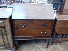 An Edwardian mahogany satinwood inlaid bureau, with fitted interior, with two long graduated drawers