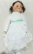 Schoenau and Hoffmeister bisque headed doll, with sleeping brown eyes, open mouth, jointed