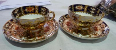 Pair early nineteenth century Davenport teacups and saucers, in Imari pattern, (af)