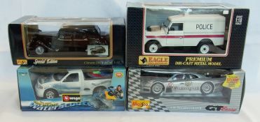 A 1/21 scale Burago diecast model of a Ford SVT F150, a Maisto 1/18 scale Mercedes CLK GT R, a