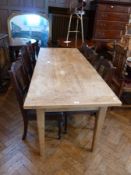 Old pine rectangular top kitchen table, with clicit ends, on square tapering legs, 191 cm long