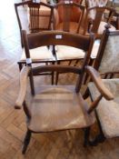 Nineteenth century hardwood open arm kitchen dining chair, with curved shoulderboard and