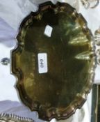 A silver salver with piecrust border and pad feet, Sheffield 1978, diameter 26cms, 16ozs approx.