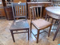 A set of four twentieth century oak dining chairs, with curved splat backs, upholstered drop in