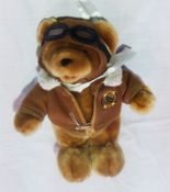 1903-2003 commemorative bear, in flying jacket and goggles, singing "Fly me to the Moon"