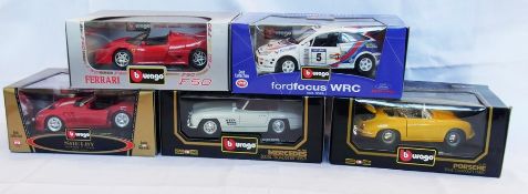 A 1/18 scale diecast model Burago Mercedes, 1957 300SR Roadster, a Ford Focus WRC, a Shelby 1999