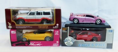 A 1/18 scale diecast model of a Plymouth Power, a Ferrari GTO and a Toyota Landcruiser 1992 and a