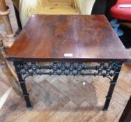 A hardwood square top coffee table, with ironwork frieze and clustered legs, width 61cms