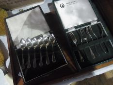 A set of six silver cake forks, Sheffield 1931 in a fitted case, together with a set of six silver