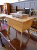 Twentieth century walnut work table with rising top enclosing fitted interior with cottons, wool