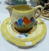 Clarice Cliff pottery milk jug, with matching plate and larger plate, yellow ground with blue,