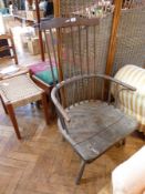 Nineteenth century rustic railback chair, with shaped toprail, curved arms, on turned splayed