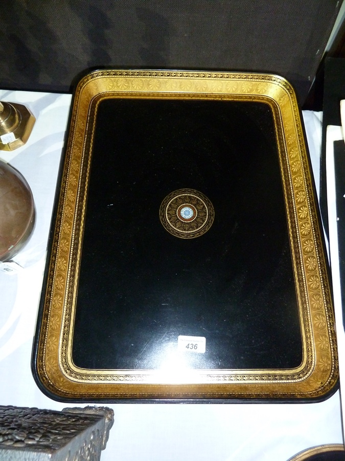 Victorian papier mache rectangular tray, with gilt border and black ground with circular central