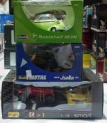 A 1/18 scale diecast Revell model of a Messerchmitt KR 200, a BMW Isetta 250 and a Maisto Smart