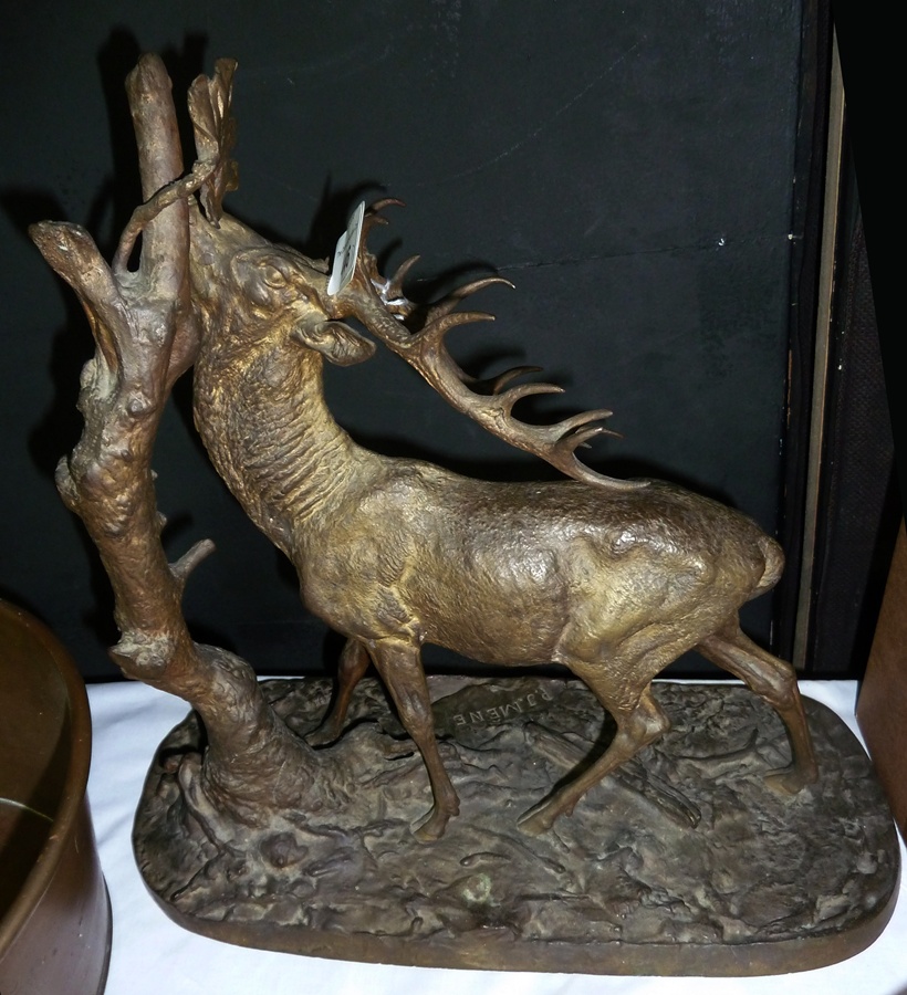 A gilded bronze stag, reaching for a leaf at the top of a tree, 38 cm overall, signed P.J. Mene