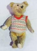 Cream plush fur teddy bear, with pointed snout, stitched claws, straw filled