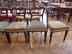 Set of six Victorian mahogany dining chairs, each with curved shoulderboard, foliate carved