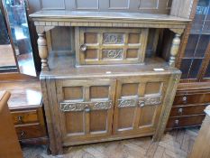 20th century court cupboard, single carved cupboard above two cupboards below on straight