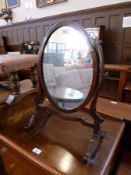Georgian style mahogany framed oval swing framed dressing table mirror on splayed supports, width
