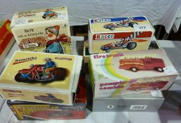 Motorcycle with sidecar, motorbike, boy on a tricycle, three racing cars and a fire truck, all boxed