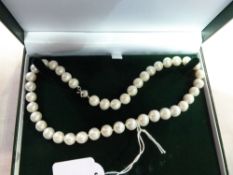 String of freshwater pearls, 12-13mm, in 18ct gold plated mount, in box