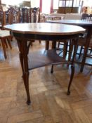 An Edwardian circular top occasional table, with satinwood inlay, on elegant cabriole supports, with