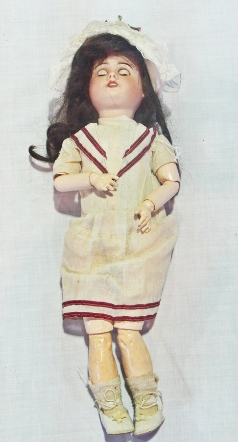 S.F.B.J. bisque-head doll, with sleeping brown eyes, open mouth, in 1920s drop-waisted dress, and
