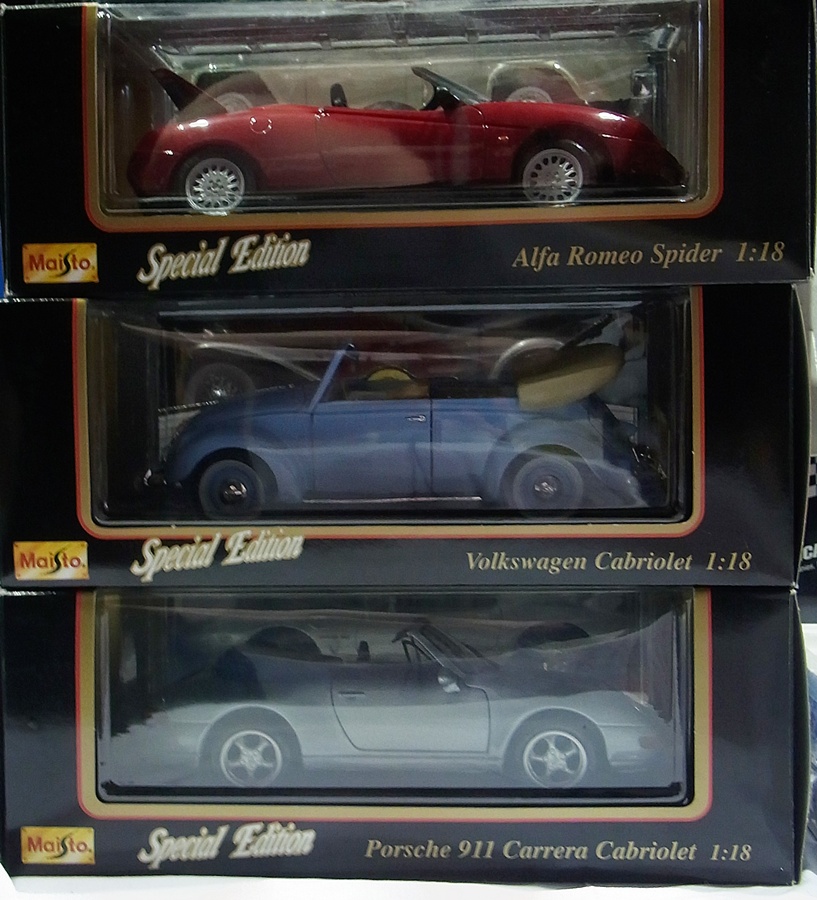 A 1/18 Scale Maisto model Alpha Romeo Spider, a Volkswagon Cabriolet, Porsche Carrera, a Dodge