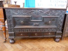 Eighteenth century oak mule chest, with rising top, serpent and foliate carved frieze with