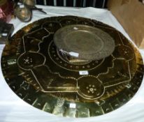 Two large circular brass decorated eastern plates (2)