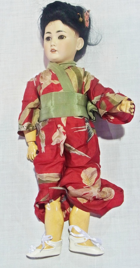 Simon & Halbig bisque-headed Japanese doll, no. 1329, with fixed brown eyes, open mouth, pierced