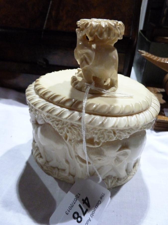 Eastern carved ivory box, oval with elephant and tree handle, carved scene to box with elephant,