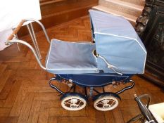 Mid-twentieth century blue painted coach built doll's pram, with blue and white leatherette hood and