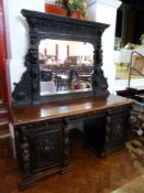 A Victorian carved oak mirror back sideboard, heavily carved with foliate and floral decoration with