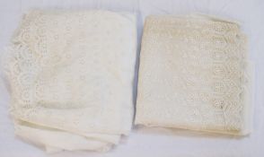 A long length of cream coloured broderie anglaise,  together with another (2)