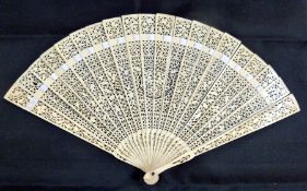 Nineteenth century pierced bone fan, decorated with central circular medallion, panels of scroll and
