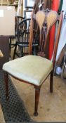 Set of four Edwardian mahogany dining chairs, distinctive design with pierced splats, upholstered