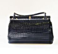 Black crocodile handbag, with gilt metal clasp and small handles