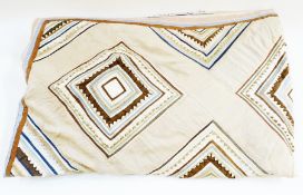 Early 20th century silk patchwork quilt, laid on a blue fabric lining, (af)