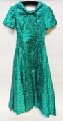 1960's turquoise satin evening dress, heavily embroidered, full skirt with a drop waist, a black