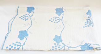 American quilt, blue applique vines on a cream ground, scalloped edge (af)