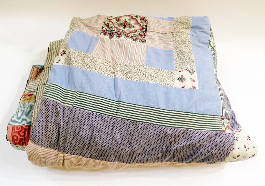 A large early 19th century English patchwork quilt reversible, patches on one side, squares on the