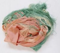 A large silk piano shawl in shades of apricot and pale green, the deep fringe in both colours