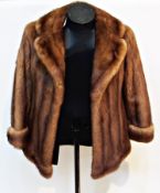 Brown mink jacket, cuffs to the sleeves, initials embroidered on satin lining