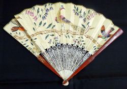 Oriental pierced ivory, lacquered and painted fan, having two floral decorated red lacquer guard