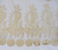 A large circular piece of undyed silk lace, floral pattern with scalloped edges, 78cm long