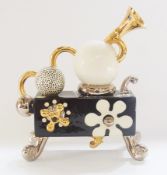 A 20th century ceramic sculpture by Mark Deally with gilt brass taps, legs and square flower